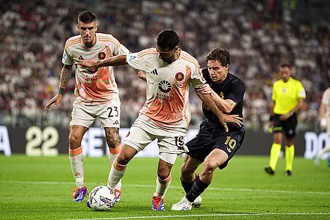 Serie A 2024-25 Juventus vs Roma: Roma's Zeki Celik fights for the ball with Juventus' Kenan Yildiz